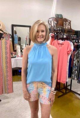 Gorgeous blue halter top paired with colorful shorts.