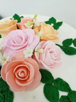 I can't find a photo of the entire cake, but the detail on these flowers is so wonderful! The flavor was outstanding.