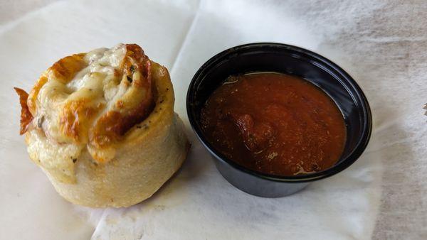 Garlic knot and sauce for dipping