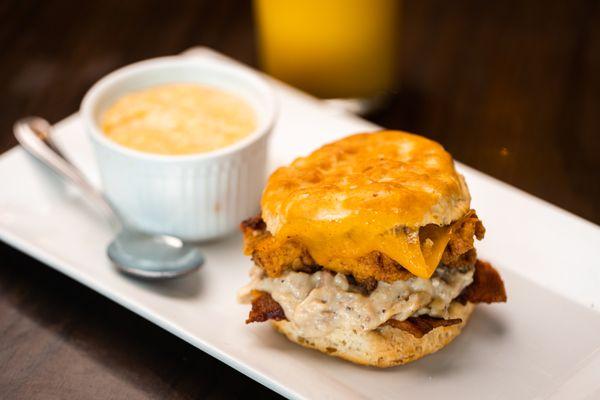 The Rooster Biscuit + pimento cheese grits are a fan-favorite breakfast combo