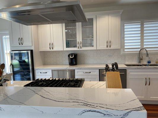 New cabinets, including custom cabinet for wine fridge, quartz counters.and  installed new appliances