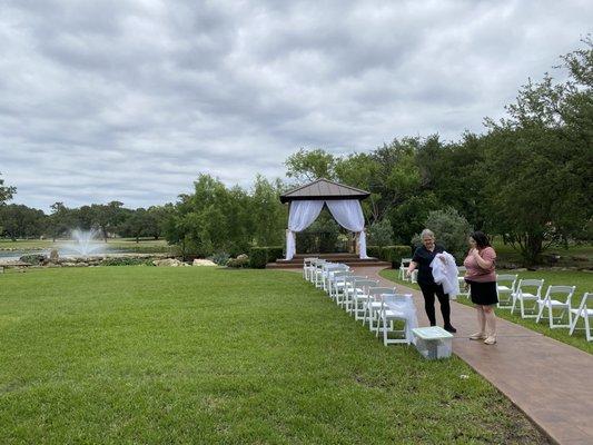 Setting up outside with fountain in backdrop