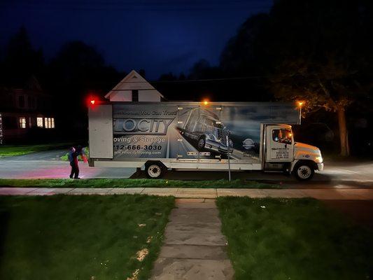 One of two Velocity moving vans, working into the night.