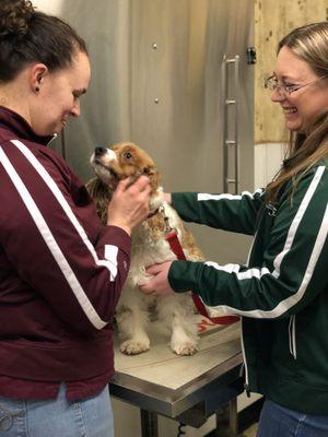 Dr.McIntosh performing an exam with the help of Julie