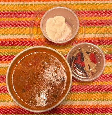 Brought home the excellent chicken tortilla soup with sour cream & tortilla strips. Not too spicy!