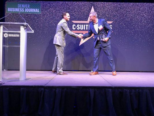 Managing Principal, Bill Baldwin, accepts C-Suite Award