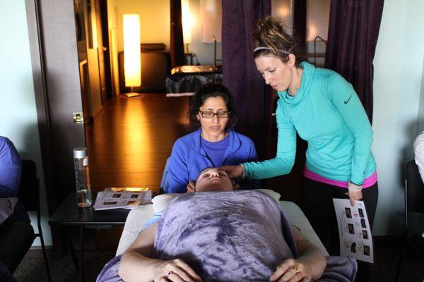 Anna Marie Blessing, B.Msc teaching a Healing workshop to 20 of her clients.