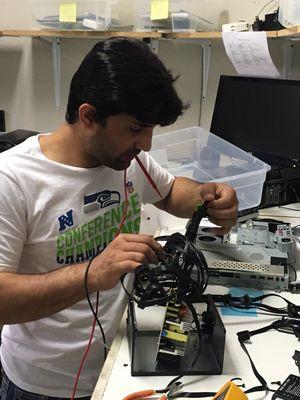 Our electronics technician Atif at work.