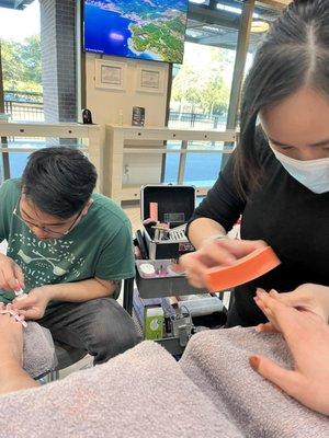 Two nail techs giving you their undivided attention at the same time!