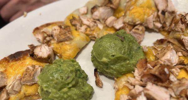 Chicken nachos (only guac for the setup, it typically comes with other things)