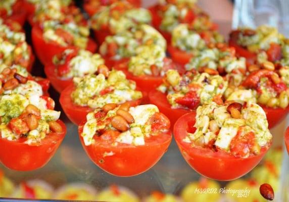 Stuffed Tomato Appetizer--with pesto, fresh mozzarella, and pine nuts