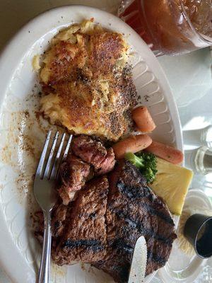 Blackened Delmonico steak with cheesy potatoes