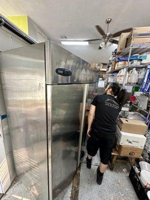 Moving an industrial fridge for Whistle Stop Ice Cream.