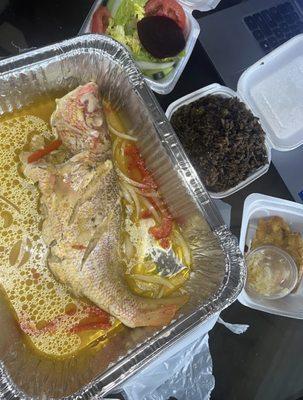 Steam Snapper Fish with Black rice and it comes with a salad and plaintains