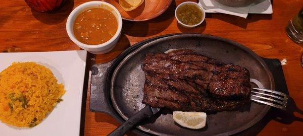 Churrasco with yellow rice and red beans