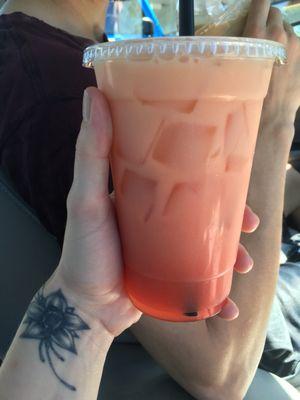 Strawberry pineapple mango Red Bull Italian soda with cream and orange juice.