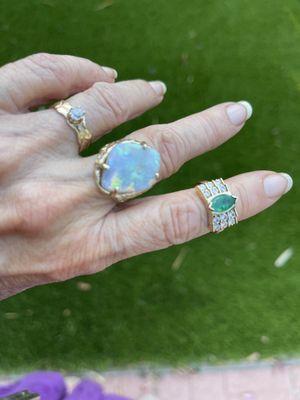 small surprise diamond
 huge opal ring
 emerald with 9 diamonds.