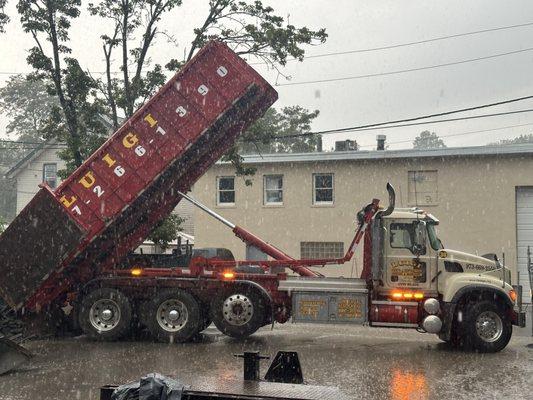 Unloading a dumpster from a jobsite