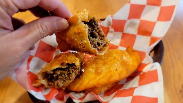 Empanadas! You can get one chicken and one beef. I think $8 total for 2