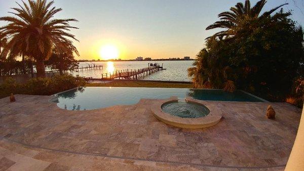 Infinity pool with Silver travertine pavers.