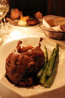 duck confit served with sweet mashed potatoes and asparagus