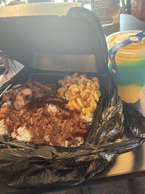 Jerk chicken, Mac and cheese, and rice. With The Trojan daiquiri