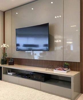 Custom Faux marble facade designed by BQE. A 70" TV on a Tilting mount while all cables and power outlet are concealed for a spotless view.