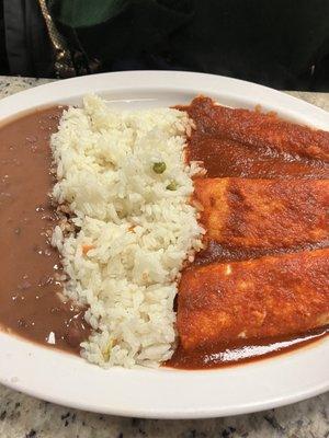 Chicken enchiladas with beans and rice.  She ordered hers dairy free.