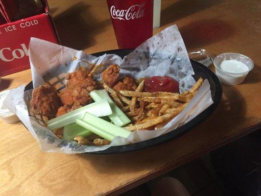 Mild boneless wings. Fries with malt vinegar and some celery. Delish