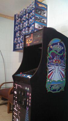 Hot Wheels for sale and an arcade game in the waiting room.