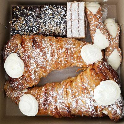 Brownies, napoleon, cannoli, french cream lobster tails. So delicious!