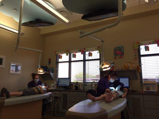 Both kids getting their teeth cleaned while watching a movie. I sat close by the entire time.