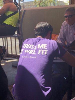 Waiter wearing great shirt!