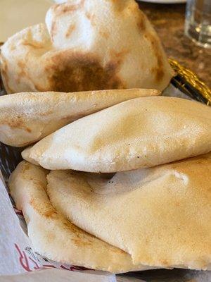 Freshly baked pita breads. Keep them coming!