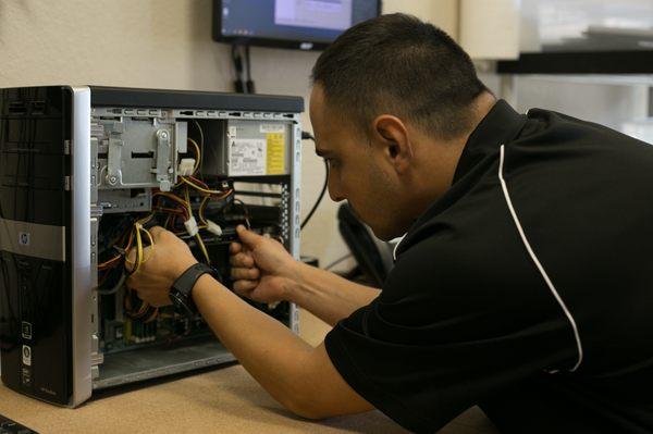 Anthony repairing customer desktop PC