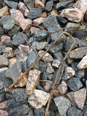 Rusty spikes left throughout yard and garden