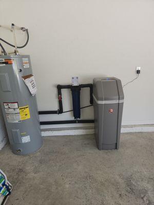 Installed water softener and water heater in garage