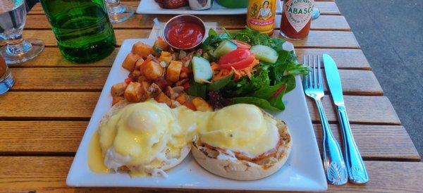 Eggs benedict with home fries brunch.