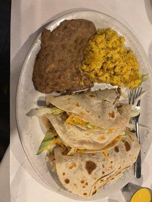 2 beef 1 chicken soft taco dinner with refried beans and Mexican rice.