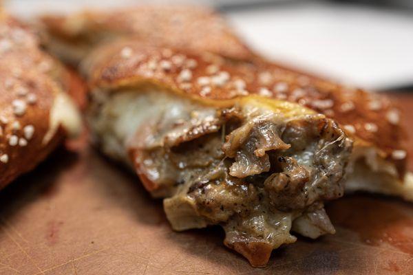 Philly Cheesesteak wrapped in a PRETZEL crust. WHAT?!