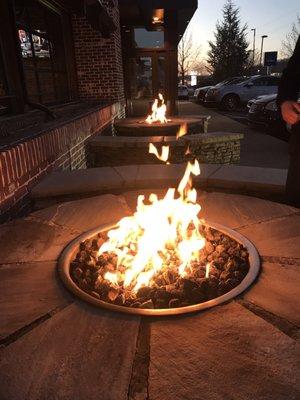 Stay warm by the outdoor fire pits  Beware the benches are