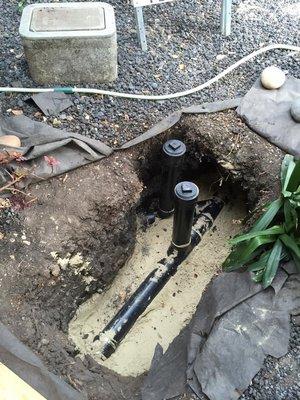 Sewer line repair and installation of a two-way clean-out.