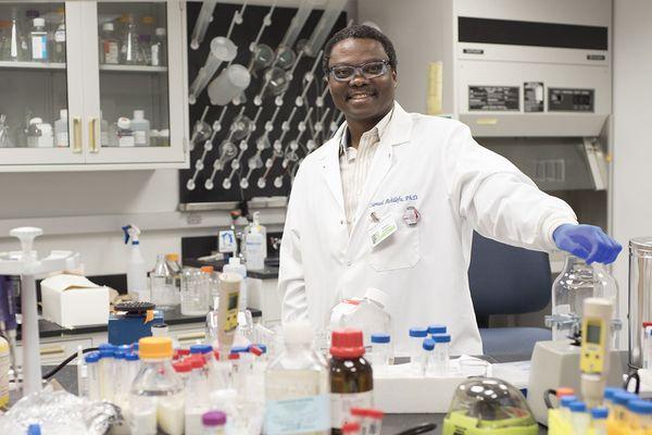 Siteman research member Samuel Achilefu, PhD, the Michel M. Ter-Pogossian Endowed Chair in Radiology, in his lab.