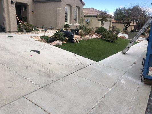 Boulders,artificial turf and rock front yard