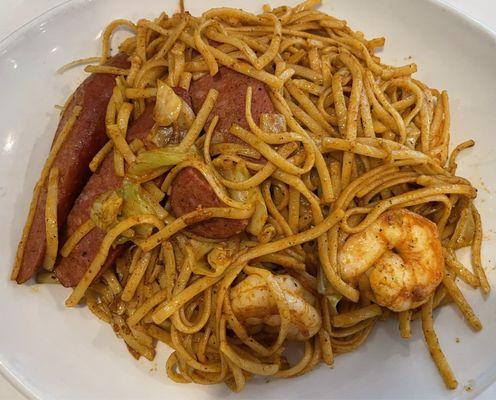 Cajun shrimp, sausage, and noodles.