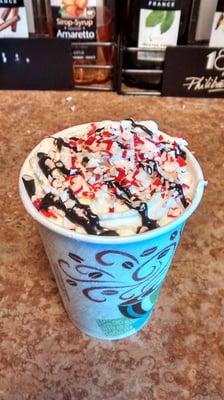 Peppermint mocha with whipped cream, chocolate drizzle, and peppermint pieces!