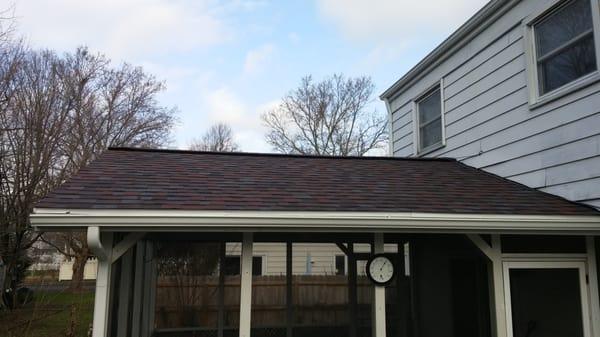 After shot of the Sun-room roof and new gutters