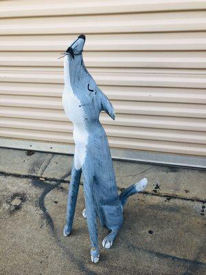 Wooden dog sculpture