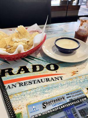 Menu and chips and queso