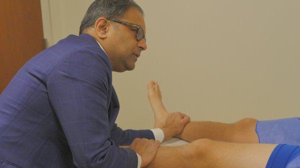 Dr Srino Bharam performing a hip examination - https://www.srinobharammd.com